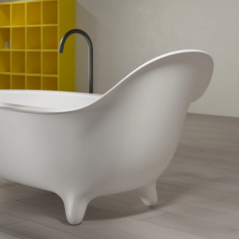 Modern white standalone bathtub featuring armchair inspired silhouette and smooth finish