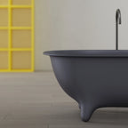 Modern grey single slipper bathtub designed with ergonomic back support for relaxing baths