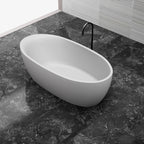 Deep soaking solid surface freestanding tub with sleek oval design