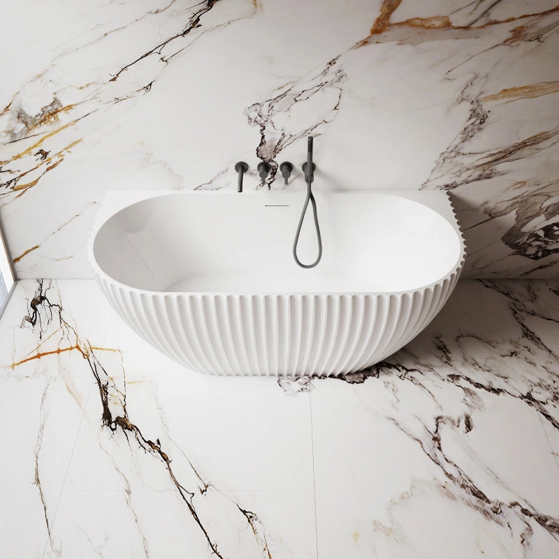 Contemporary acrylic back-to-wall bathtub with textured fluted exterior and deep soaking design