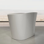 Glossy white freestanding soaking bathtub with hidden overflow and pop-up drain