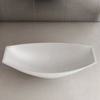 Modern solid surface soaking tub with unique hammock inspired freestanding design