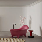 Pink solid surface freestanding bathtub with armchair inspired design by MonBlari