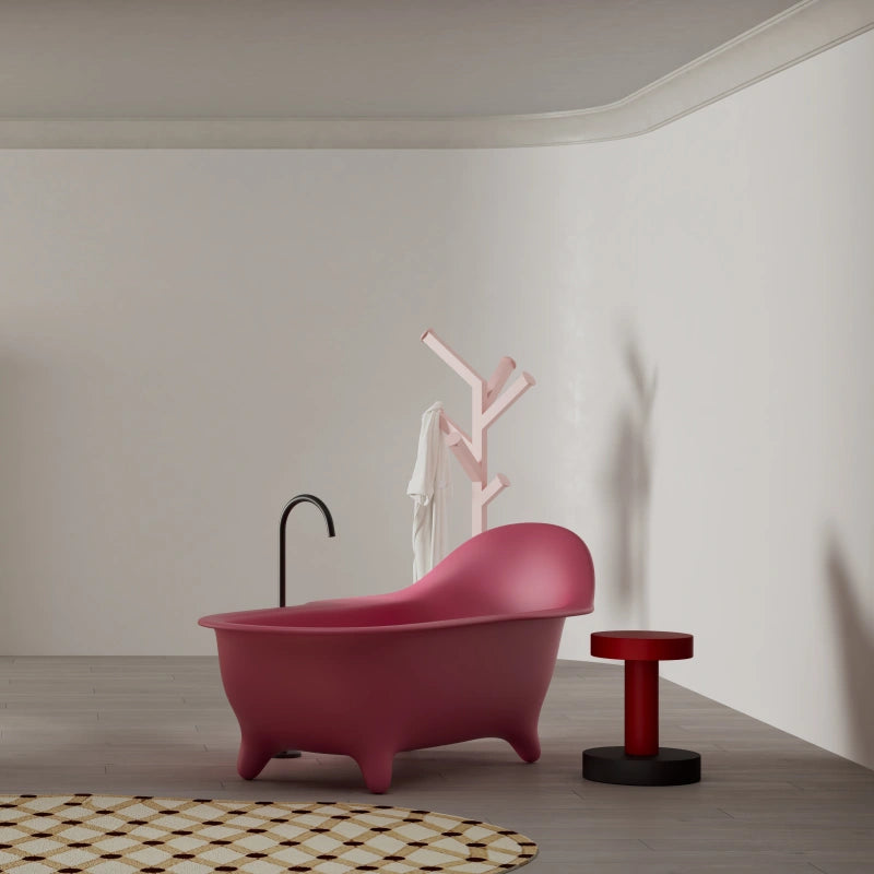 Pink solid surface freestanding bathtub with armchair inspired design by MonBlari