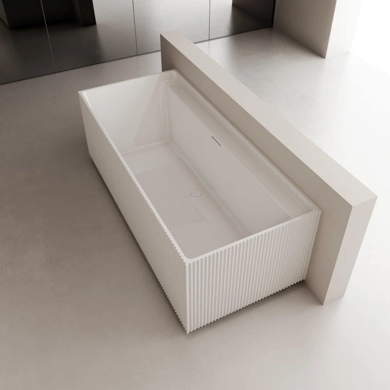 Contemporary rectangular acrylic bathtub with hidden overflow and fluted side panels