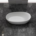 Solid surface soaking tub with minimalist oval shape
