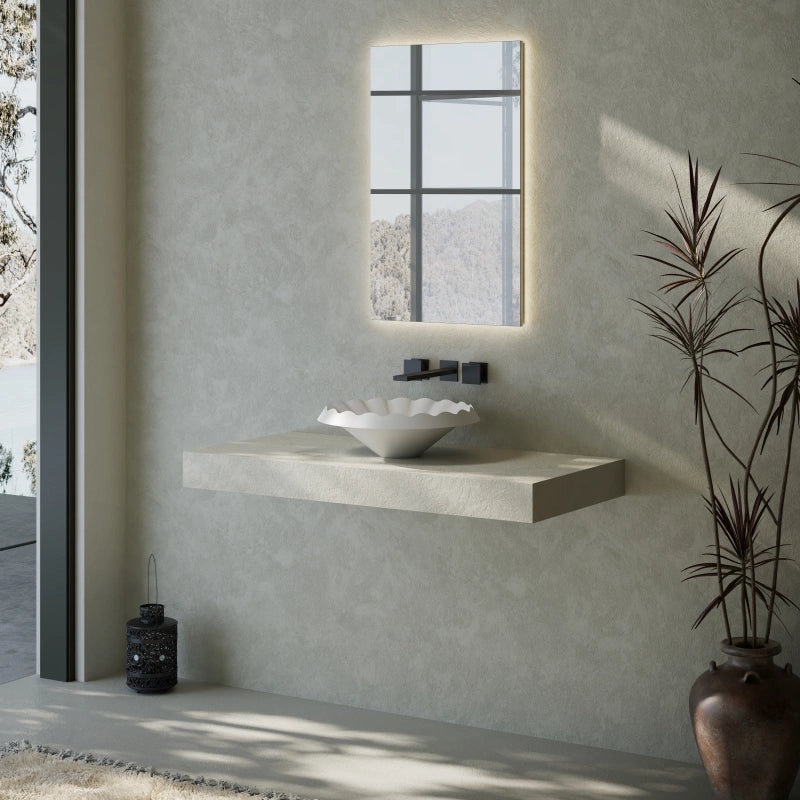 Solid surface bathroom sink with flowing ruffle design