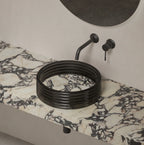 STRATA Series sculptural marble round vessel sink with clear acrylic