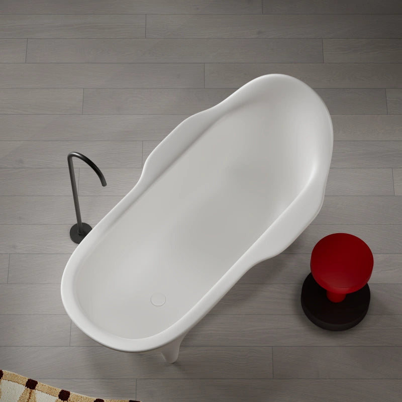 Modern white standalone bathtub featuring armchair inspired silhouette and smooth finish