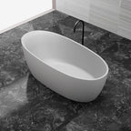 White solid surface oval freestanding bathtub side top view close-up